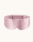 Pink silk eye mask on a white background