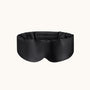 Black sleep mask on a white background